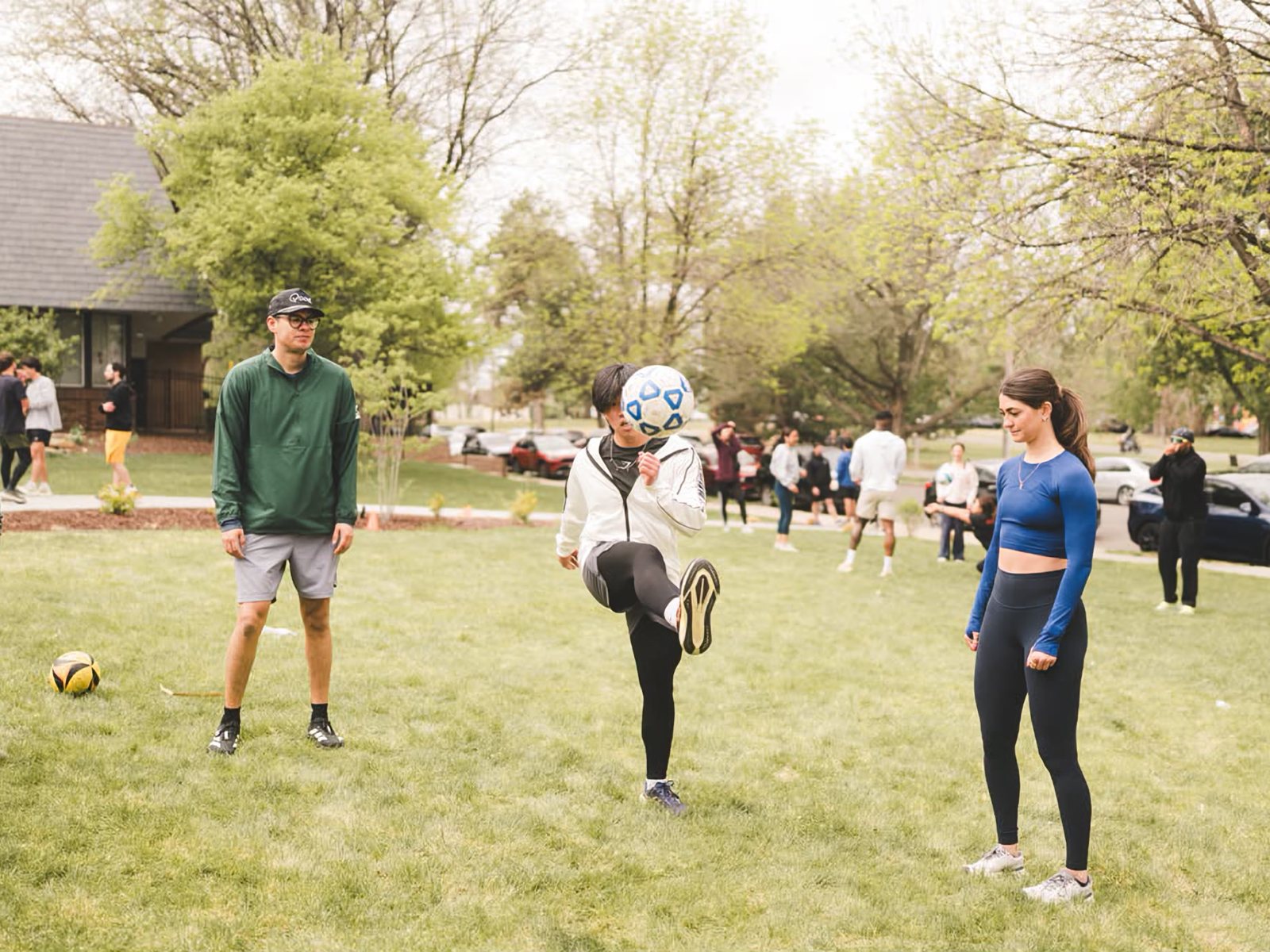 RWC Denver people playing a ball game together on the grass