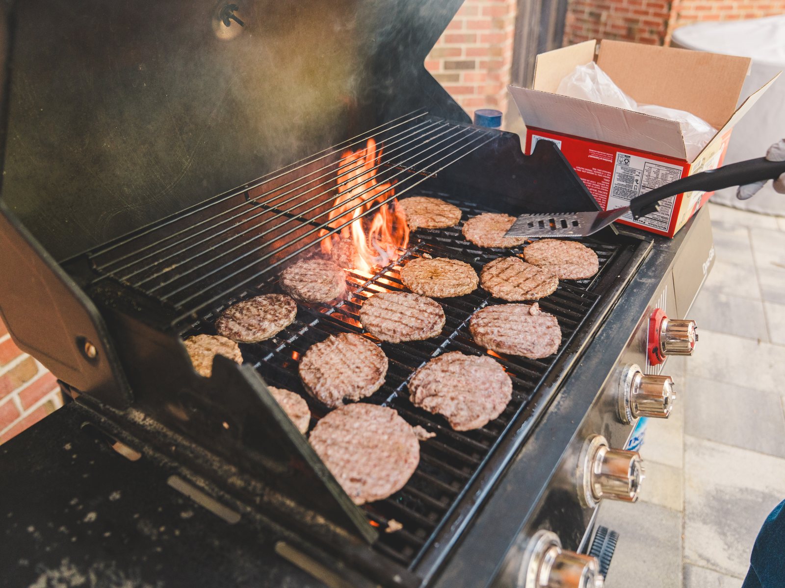 Burgers on the grill at an RWC Denver event