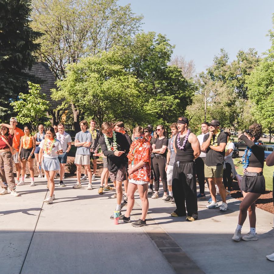 Two lines of people cheering runners through